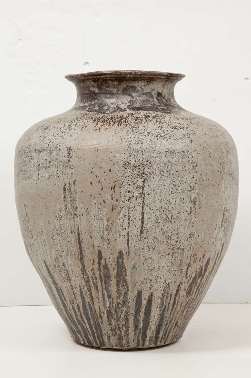 A large scale stoneware jar with stoney white and ash spotted glaze. Of classic jar form. Paul Chaleff, American.