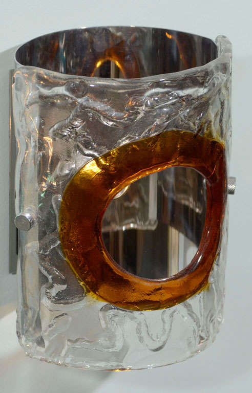 Italian glass and chrome sconces attributed to lighting manufacturer Mazzega, circa 1970. Hand formed clear with amber glass shade front and chrome plate back. Each sconce measures 6