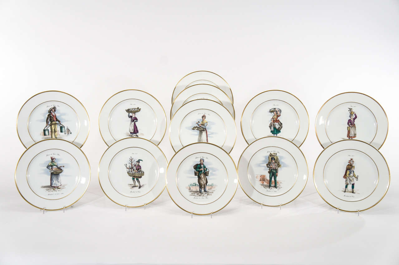 A fabulous set of 12 porcelain dinner plates, each decorated with engravings of trades of Old Paris, 