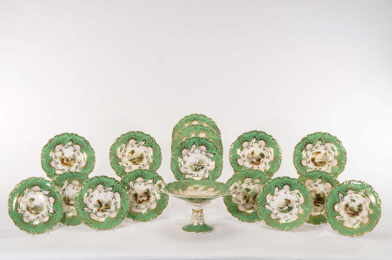 This a very early 19th c. hand painted dessert service with shaped rims and apple green ground borders all highlighted in gold. The painting is rather primitive and simple which is in keeping with the period. The artists were not as well refined as