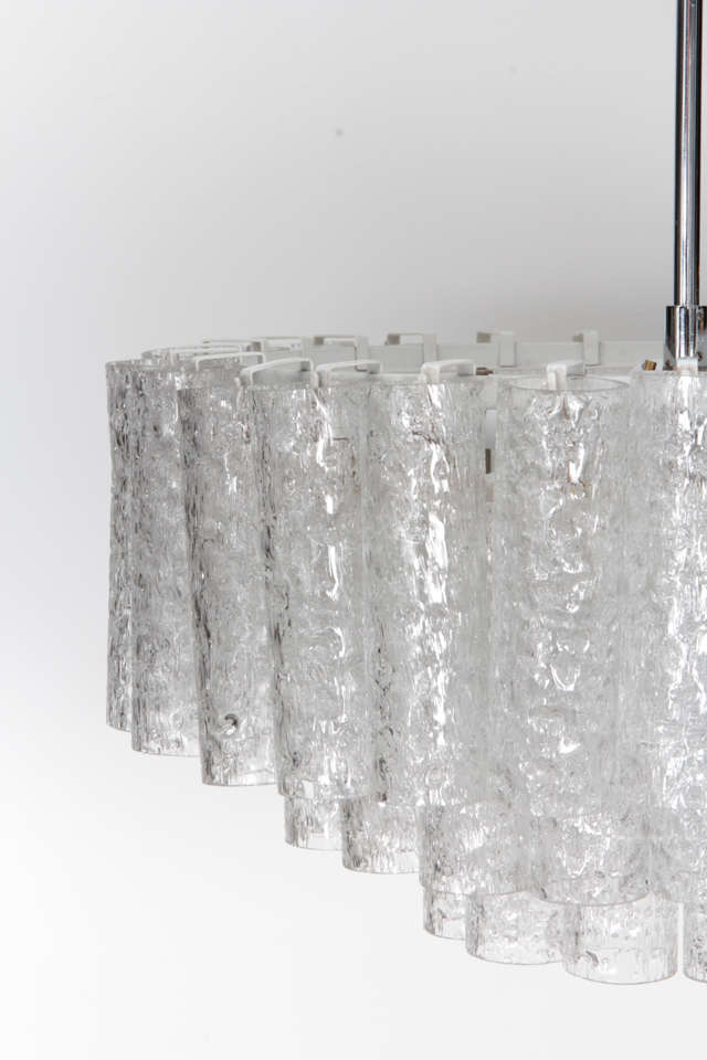 Fantastic three-tier textured glass tube chandelier on a polished nickel stem and canopy by Doria. Chandelier body measures 12