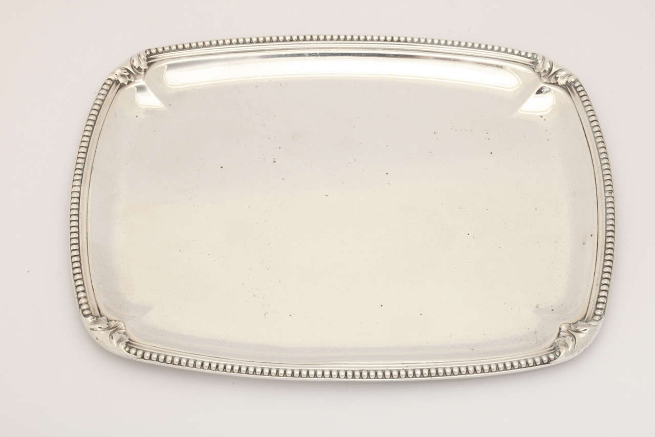 Rectangular tray with rounded corners and beaded border.
Hallmarked for 950 silver/ T Fres stockpot/ 28141.

8.45 ozs.