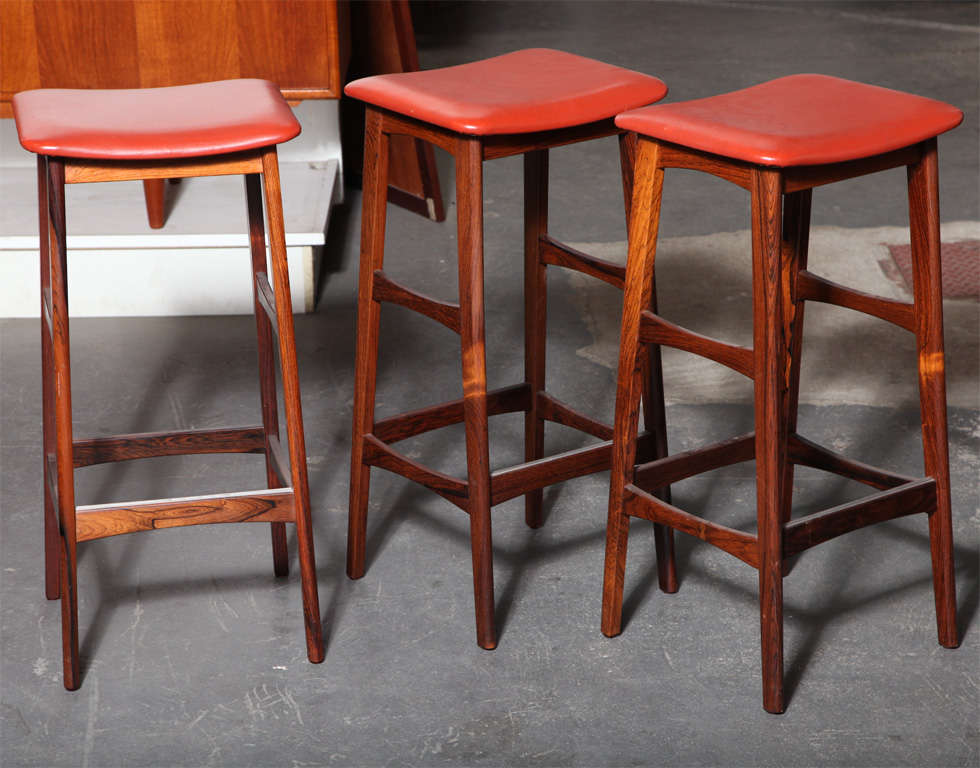Vintage 1960s, Dyrlund barstool. 

Original 1960s rosewood barstool by Dyrlund. Features solid wood frame, curved seat in original vinyl seat and slender profile. Ready for pick up, delivery, or shipping.