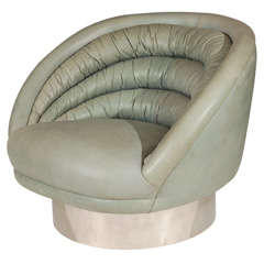 A Rare Channel Tufted Barrel Swivel Chair