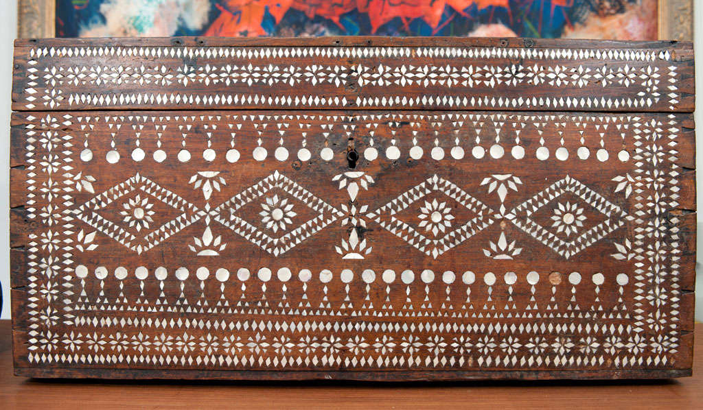 Beautiful wood coffer with intricate inlaid mother of pearl design.