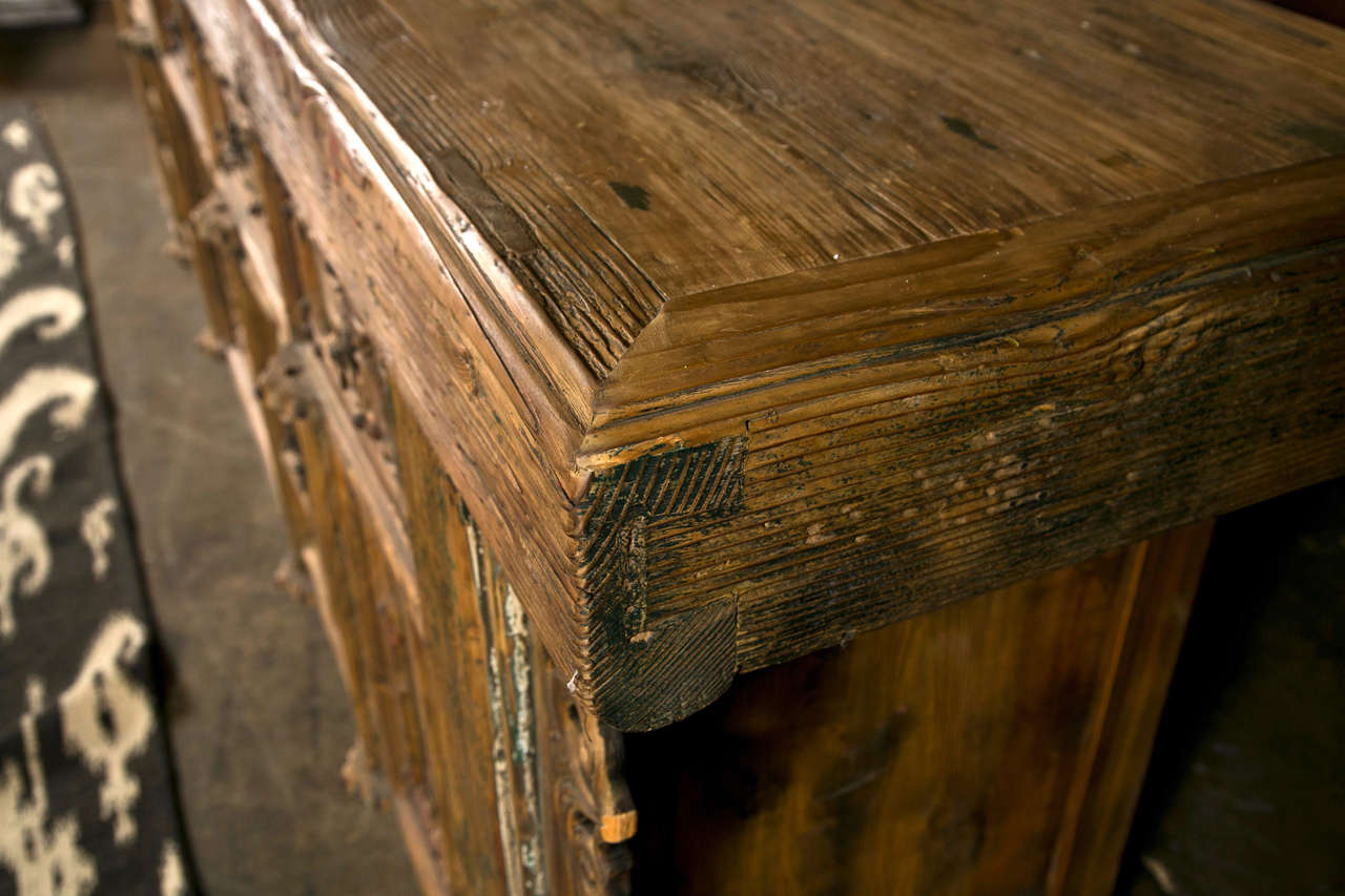 Chinese elm and pine buffet, c. 1850, Shanxi region,  with traces of red and black lacquer, 5 drawers over 4 large and 4 small door doors, very nice thick top