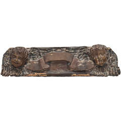 Carved wood fragment with putti
