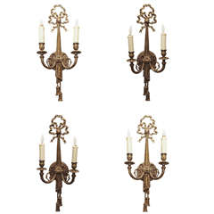 Set of four bronze two light wall sconces