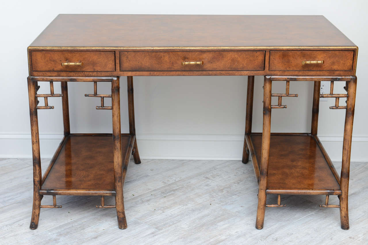 Charming Chinoiserie Burlwood desk with lovely fretwork and brass faux bamboo pulls.