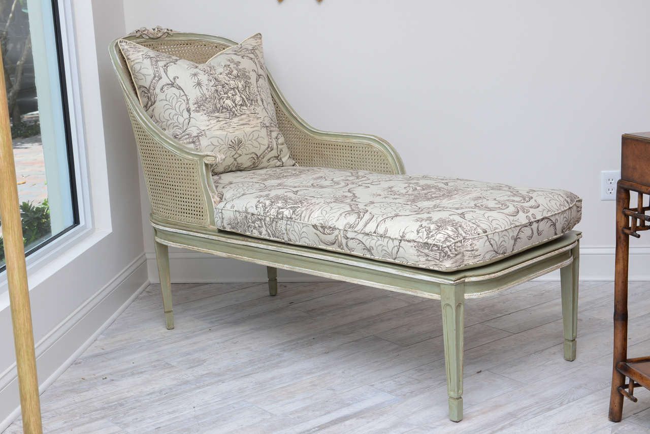 Elegant French chaise longue with new double caned back and sides and caned seat. Beautiful new toile fabric.