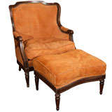 Suede covered chair and ottoman