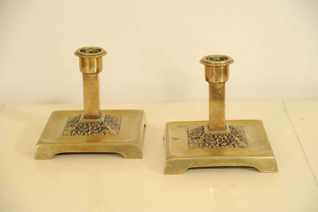 A Pair of Aesthetic Bronze Candlesticks