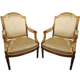 Pair of 19th Century large Louis XVI open arm chairs