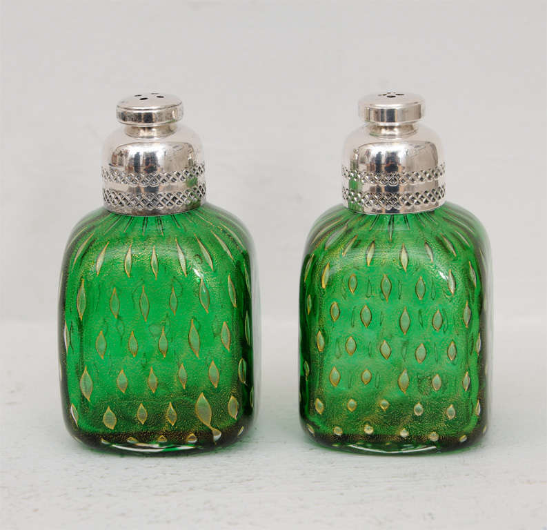 Wonderful pair of Murano salt & pepper shakers.  Green with gold inclusions and sterling silver tops.  Measurement listed is for each individual piece, price is for the pair.  Reduced from $350.

Please feel free to contact us directly for any