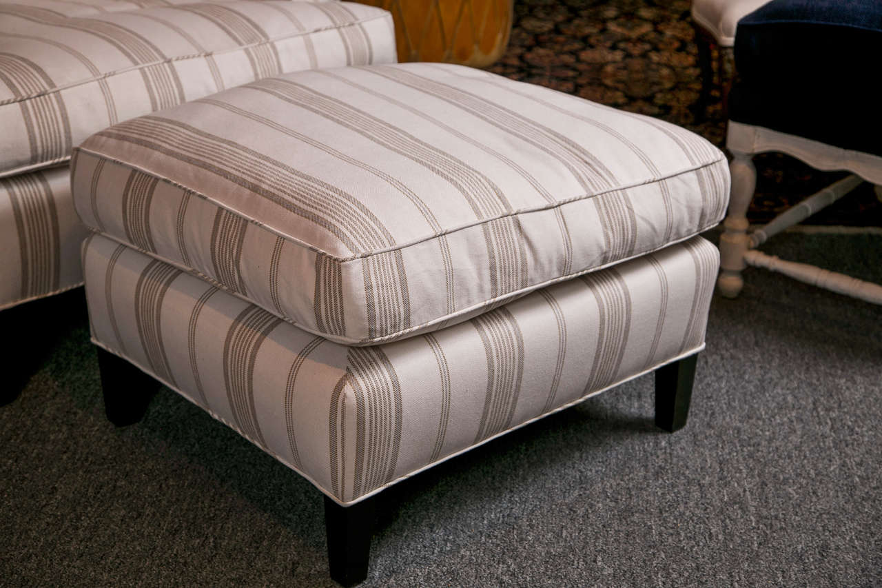 Striped club chair with ottoman upholstered in a cotton and linen fabric with down filled cushions