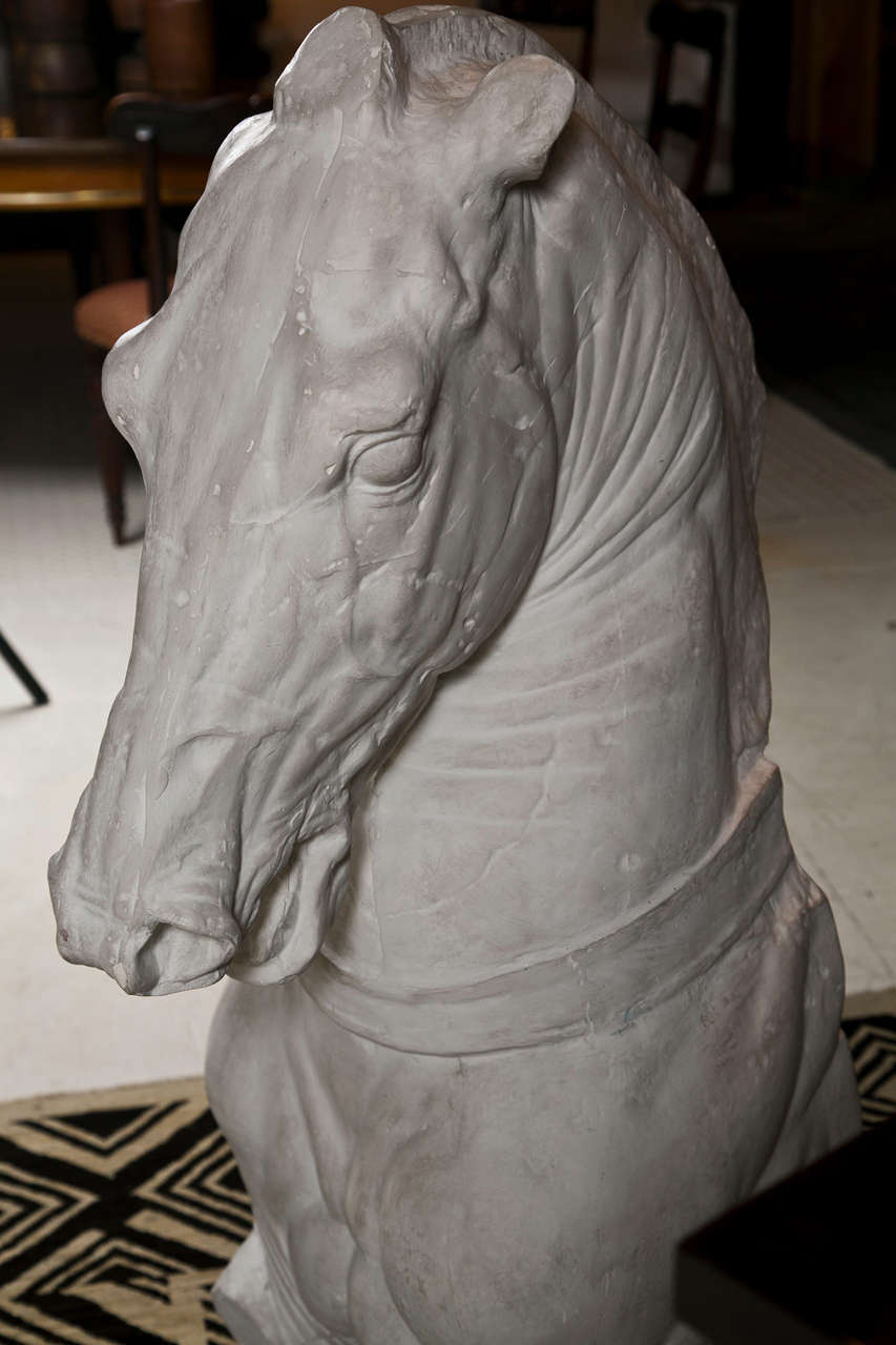 Monumental plaster reproduction of a classical Trojan horse artifact housed in the British Museum in London.  Most likely executed in the late 19th Century by a gipsoteca (plaster cast workshop) in Italy, this plaster faithfully reproduces the horse
