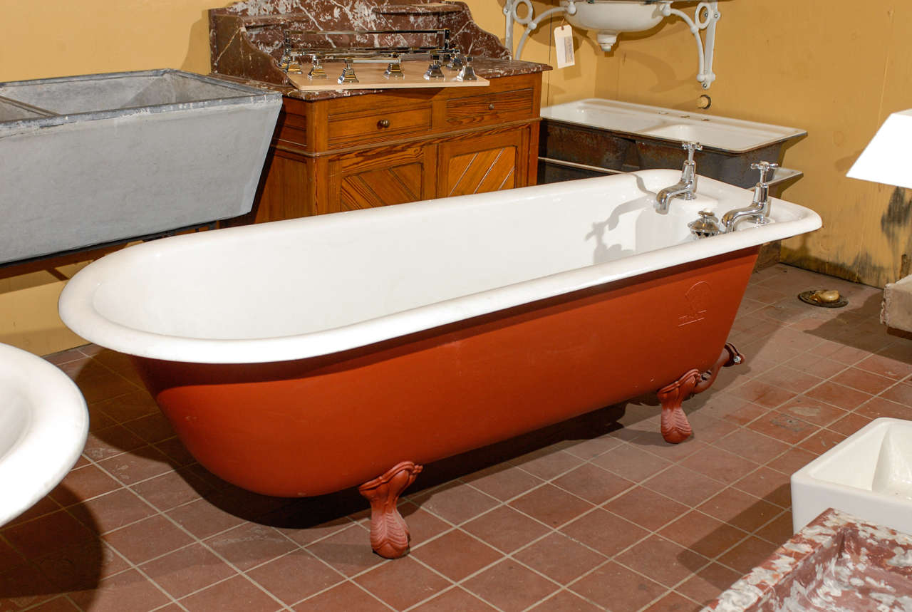 19th Century English re-enamelled claw foot bath tub with nickel Royal Doulton Faucets and drain.