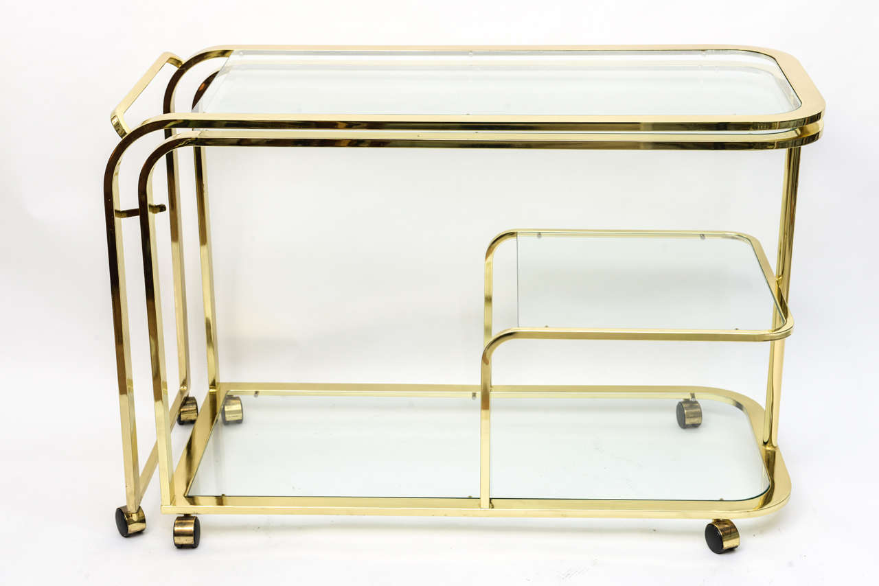 Fabulous swinging two part bar cart with three tiers attributed to Milo Baughman