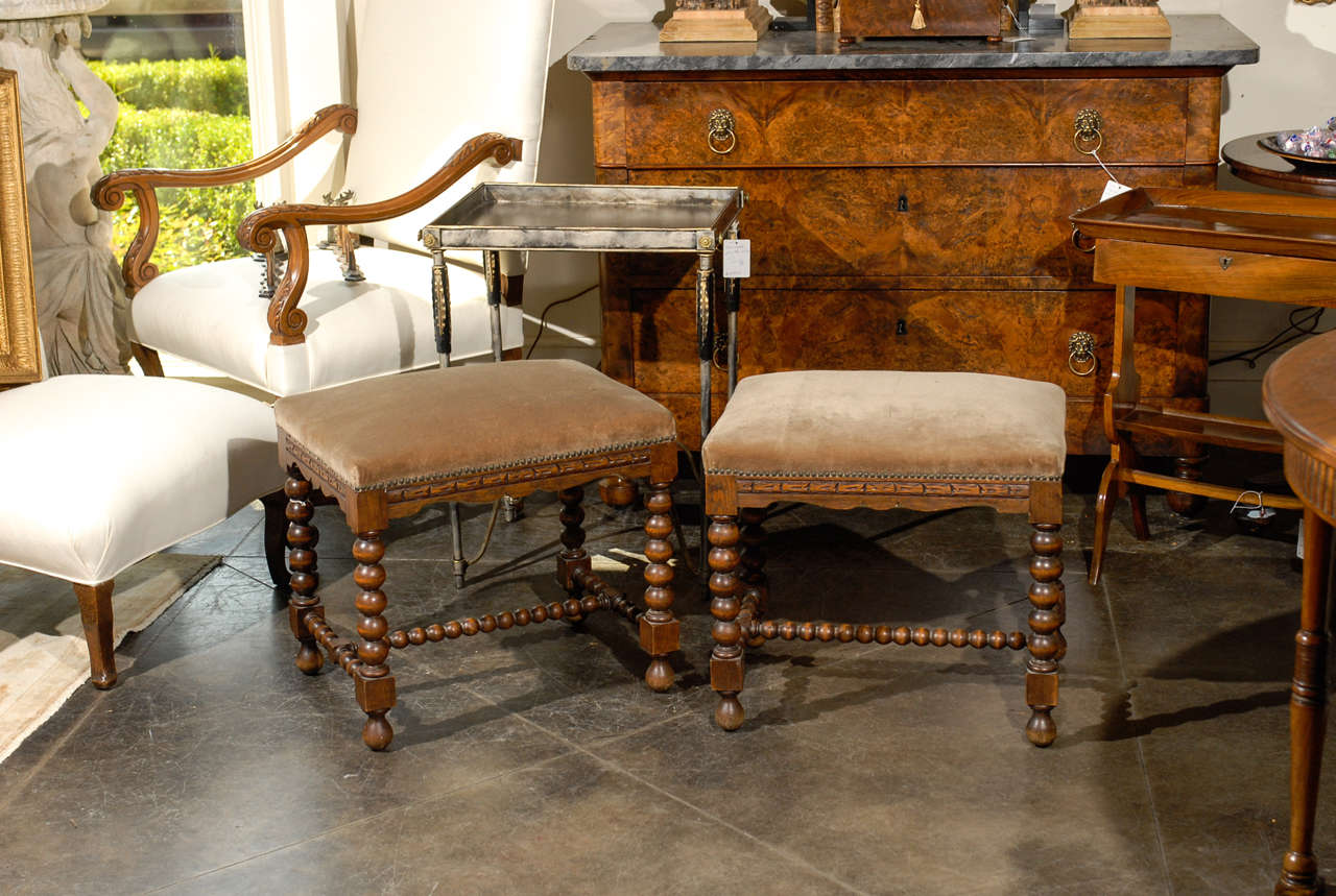 Pair of French bobbin leg stools with carving and scalloped apron.