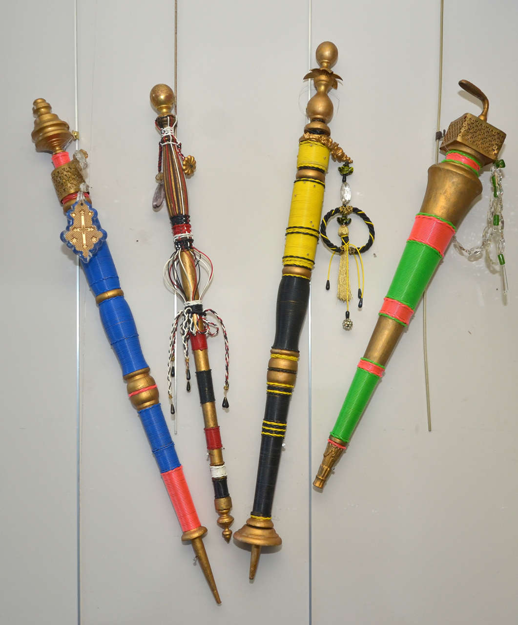 Four walking sticks made especially by Cluade Cehas for the 1995 fashion show of Christian Lacroix, in wood with plastic hanging decorations and crystal and glass drops. Unique pieces sold with the artist's certificate for each one. Normal wear