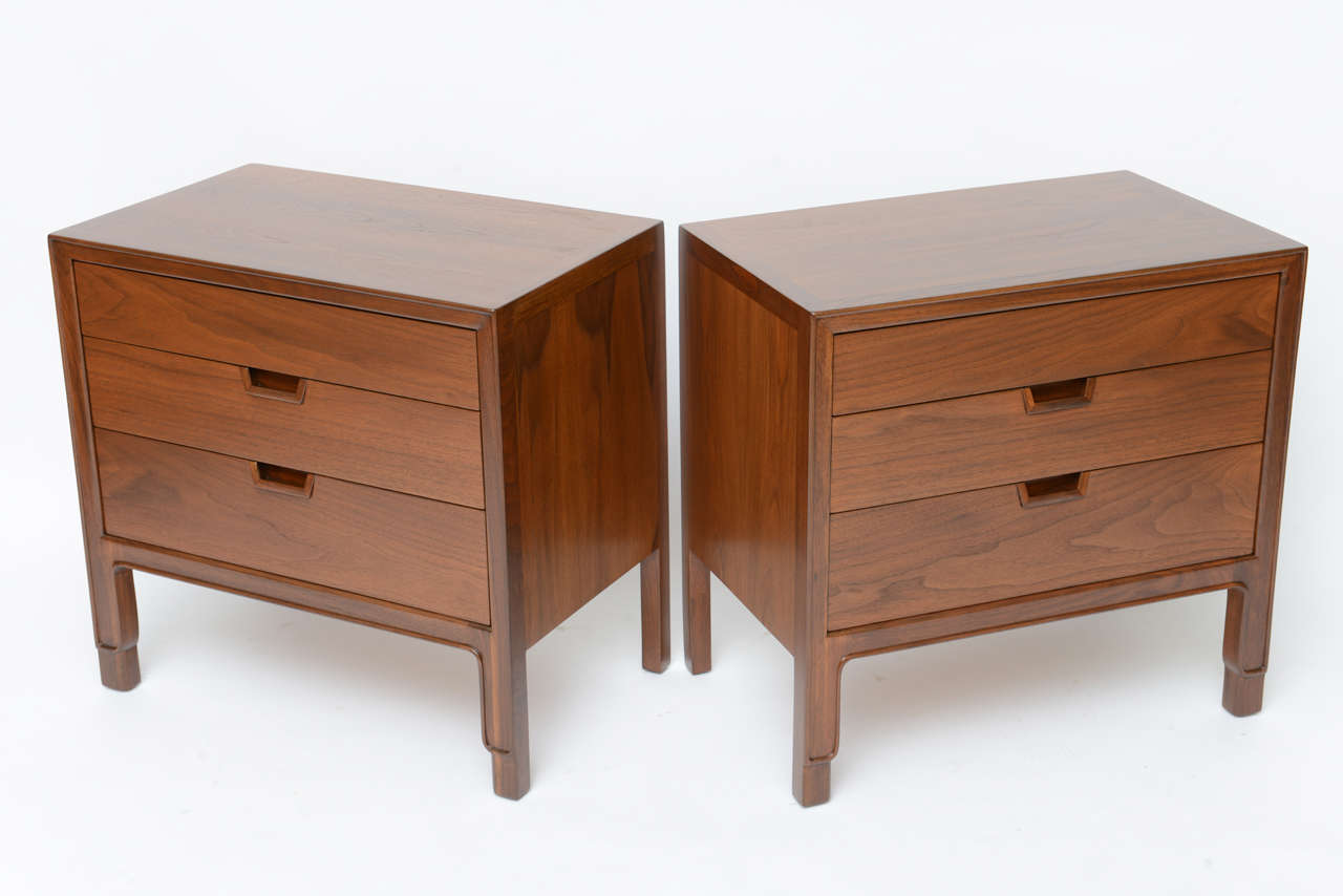 SOLD John Stuart Janus Collection nightstands or bedside tables in beautiful figured walnut with great night table storage in three drawers featuring carved out and molded pulls.  Wonderful  mid-century styling, design extras and look at me legs.