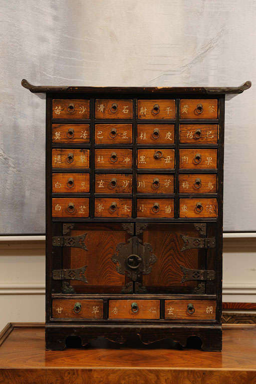 Adorable Small Chest with 23 little drawers and cupboard. <br />
The interior of the cupboard's doors and the back of the chest are covered with recipes for medicine in Mandarin