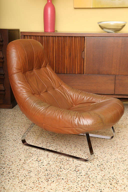 ...SOLD NOVEMBER 2011... From the Earth Collection, this early ergonomic designed lounge chair by Brazilian Percival Lafer, cups the body and is extremely comfy.  Wonderful bucket seat styling in tufted leather with suede back and nickel plated