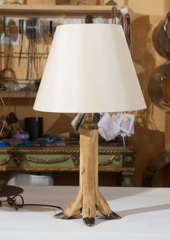 Vintage deer leg table lamp.  Four legs attach as one lamp neck.  Newly rewired.