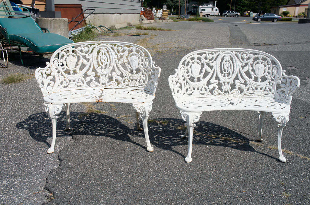 Garden settees consisting of one 19th C, cast iron and one 20th C. painted aluminum.  Settees:  29.5