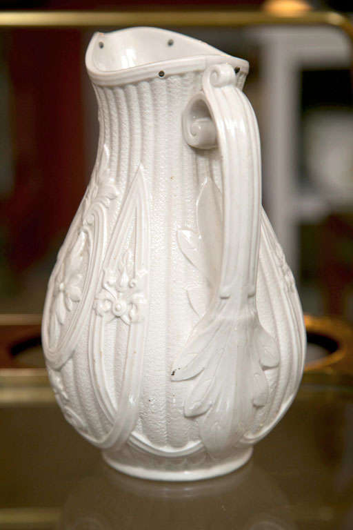 Relief molded & glazed Parian Ware pitcher.