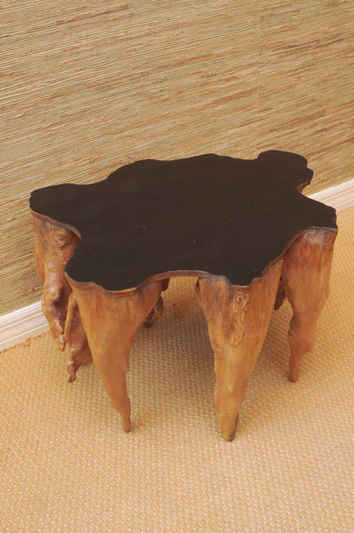 Unusual cypress side table with black lacquer top.