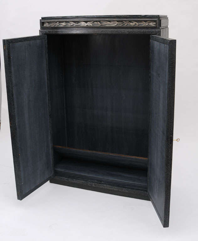 Oriental Carved bamboo two door cabinet with a light up top.
Original silver leaf on the bamboo,original open grain ceruse finish over oak.
With Four adjustable shelves