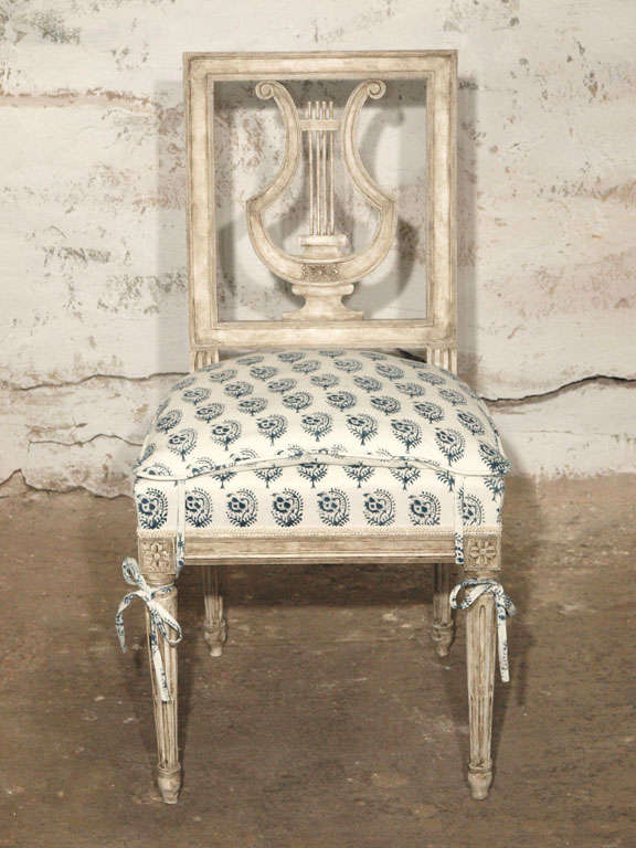 Personally refinished in a beautiful Swedish grey with blue/grey accents, this single lyre back chair would make a beautiful accent or desk chair.  Newly upholstered in an organic cotton hand made fabric from Les Indiennes in 
