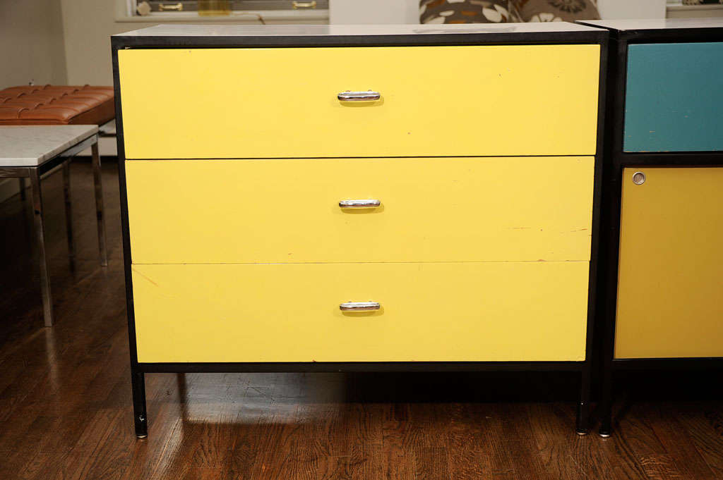 1950's steel frame dresser by George Nelson, mfg. Herman Miller.  Sliding door cabinet is sold. Yellow dresser is available-along with a matching desk sold separately.