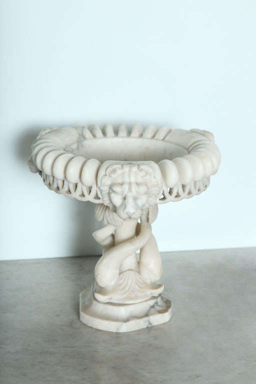 All finely carved with swirls, and dolphin supports and lion heads.