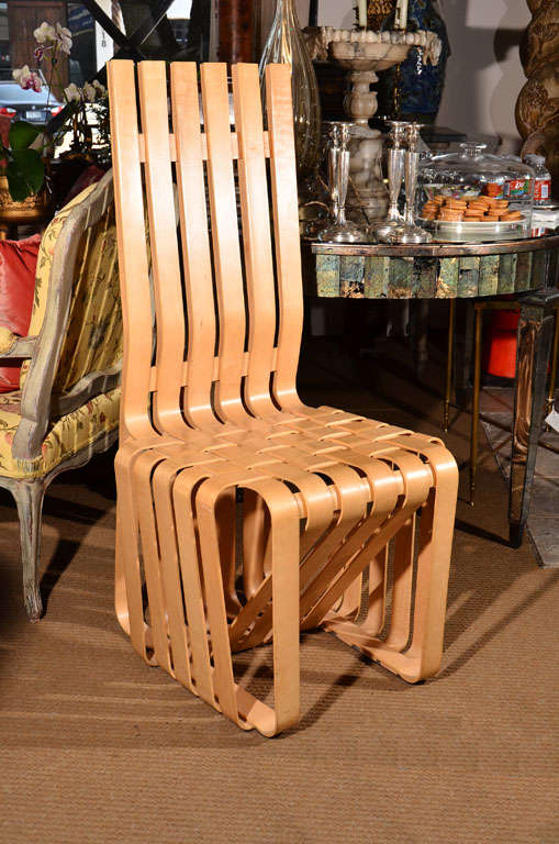 inspired by the apple crates he had played with as a child, Pritzker Prize winning architect Frank Gehry created the ribbon-like design of this chair with interwoven maple strips

stamped with the KnollStudio logo, Frank Gehry's signature, and a