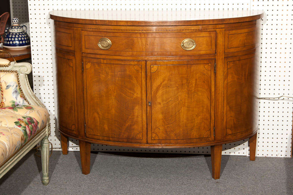 Demilune cabinet