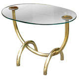 MID C U-FORM BRASS SIDE TABLE, OVAL GLASS TOP