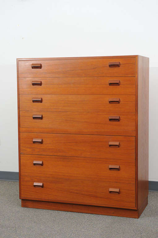 Borge Mogensen Teak hi-boy dresser on a plinth base, seven ample storage drawers. Beautiful original finish in excellent condition. Made in Denmark, marked on back. Circa late 1950's