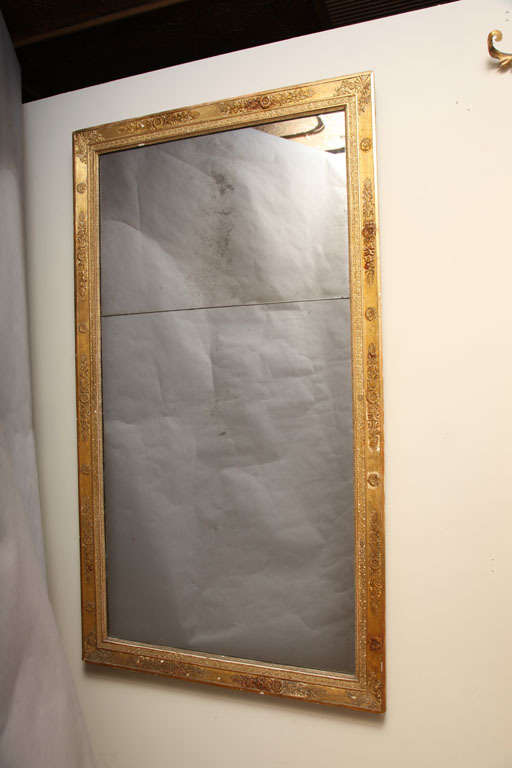 Carved giltwood mirror, Period Napoleon III.  Rectangular frame carved with floral and anthemion reliefs.