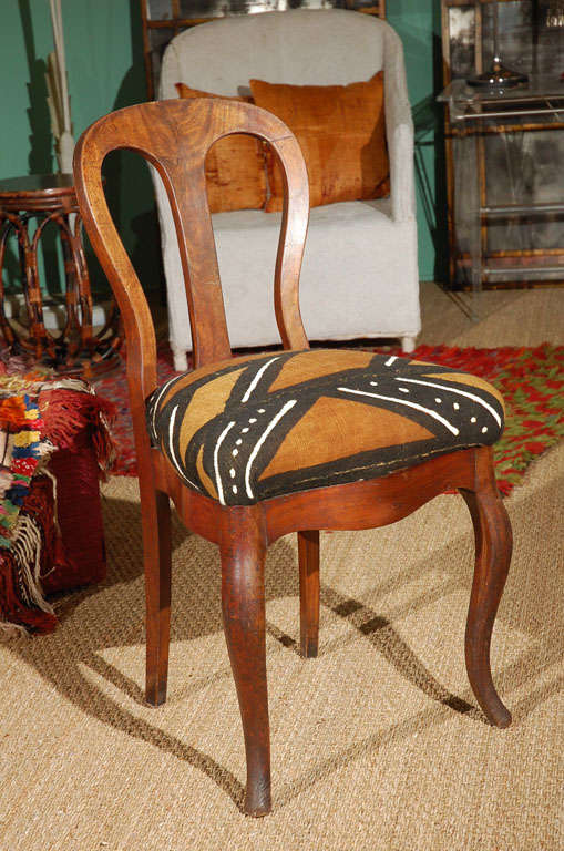 Side chair with graceful curves and flared front feet newly upholstered in an African mud cloth.
