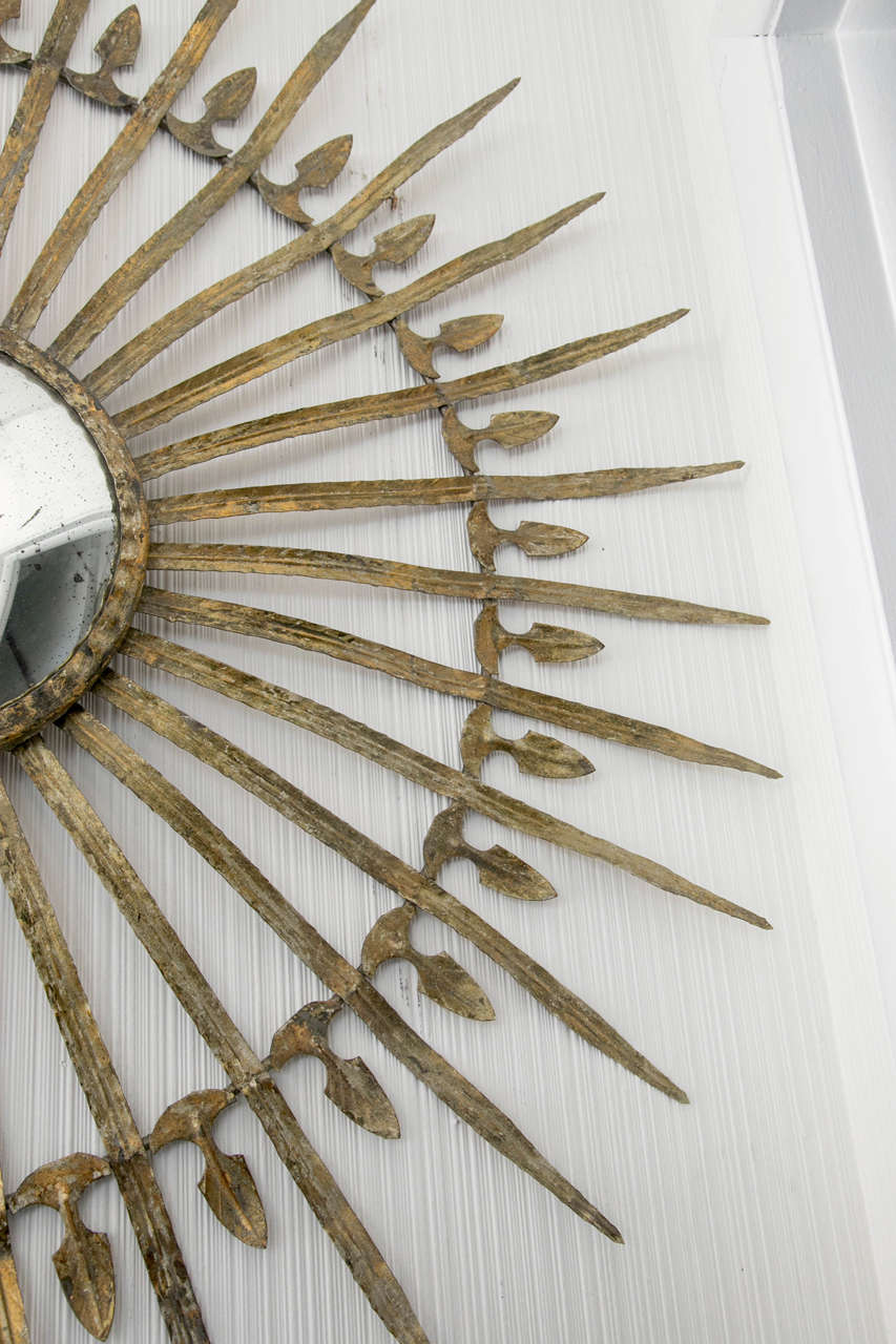 20th Century Metal Starburst Mirror with Detailed Arms For Sale