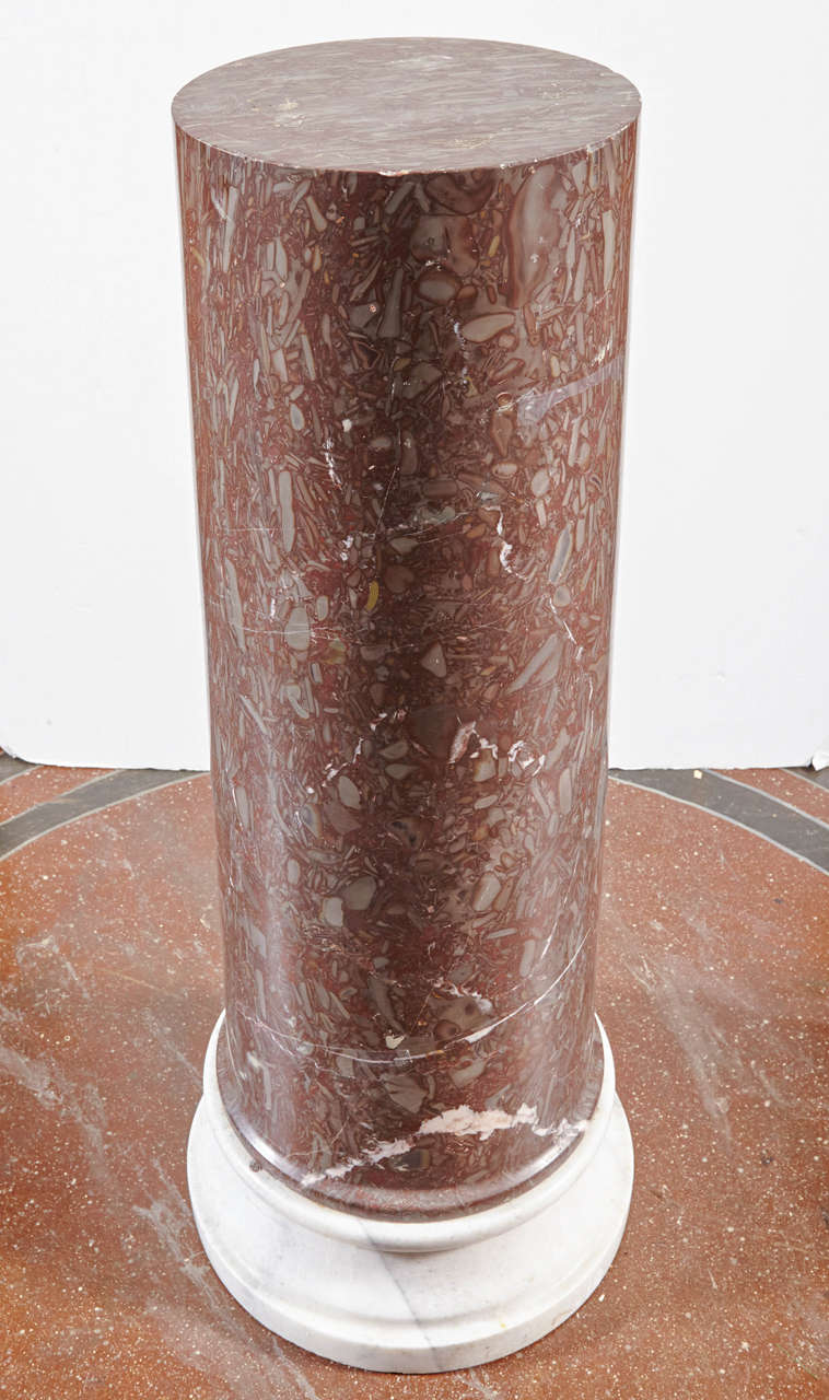 Tapered marble column pedestal on contrasting marble base. Top diameter is 12.