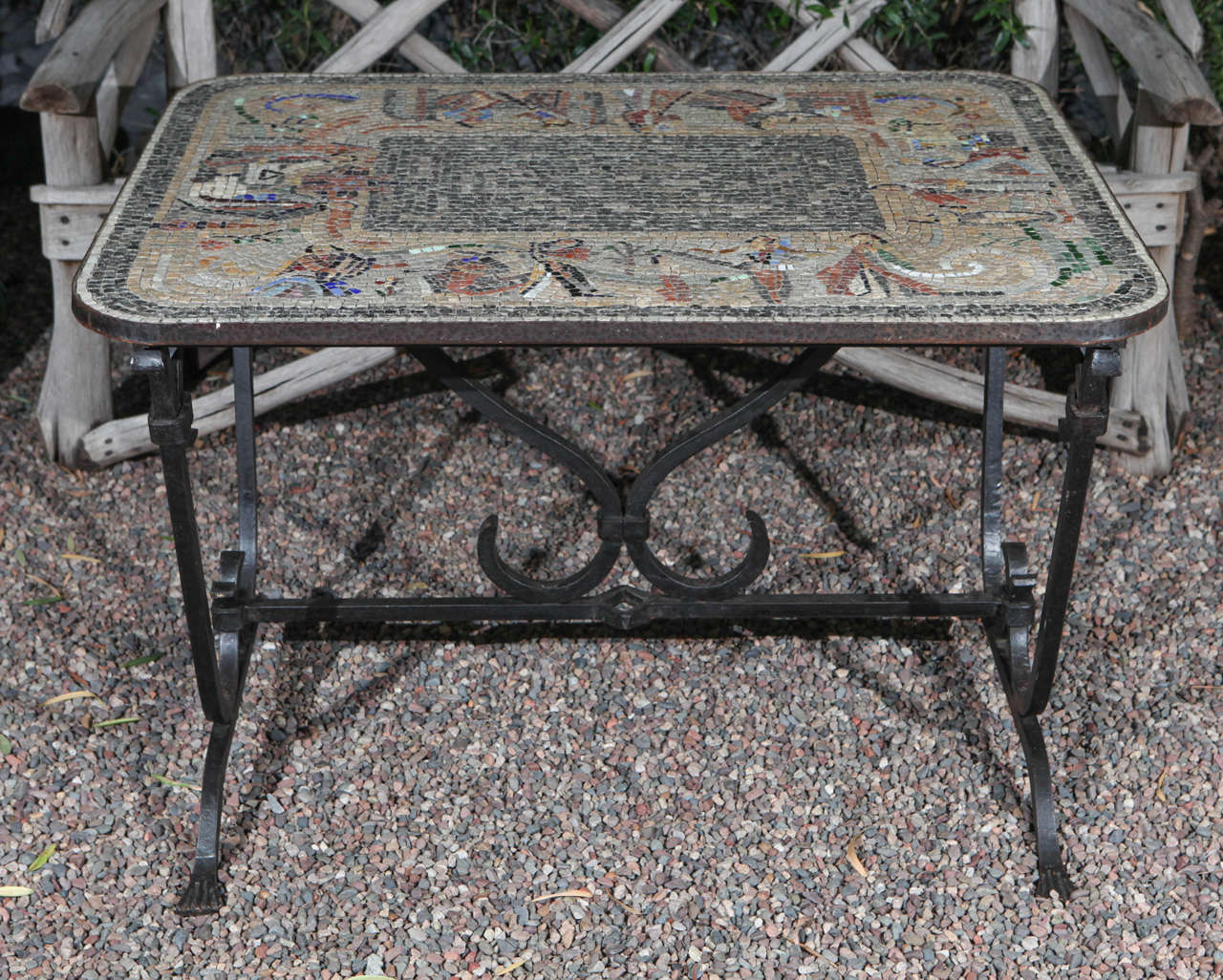 Early 20th century iron table with mosaic stone top from England. 