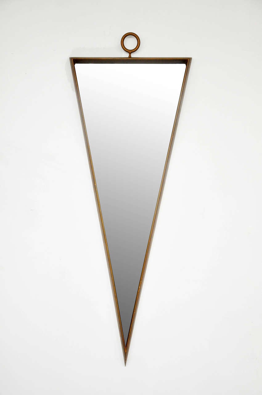 Glamorous gilt wood mirror with ring finial.  Circa 1950's.  In the style of Tommi Parzinger.
