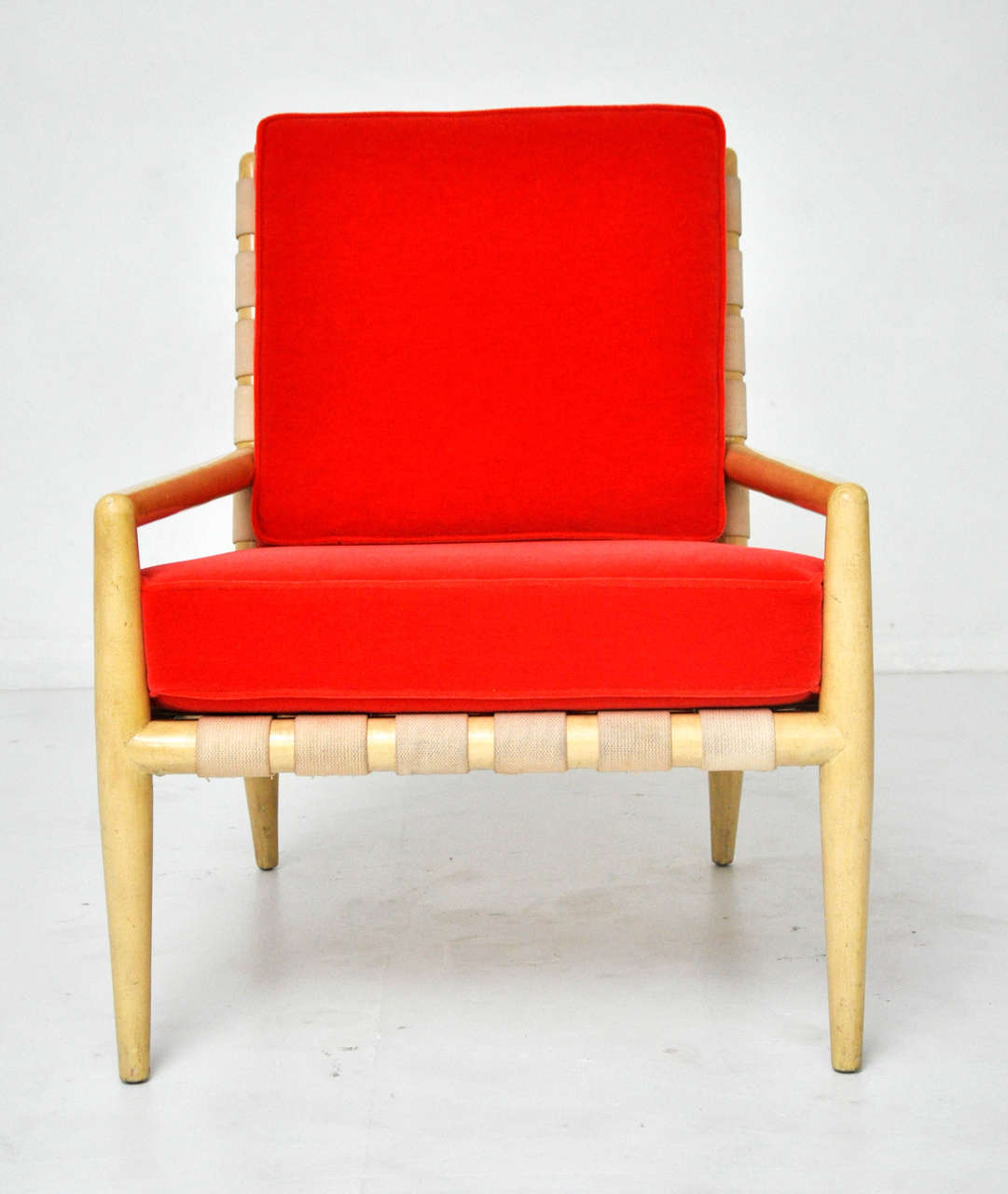 Lounge chair by T.H. Robsjohn-Gibbings. Original cream lacquer and webbing. New cushions upholstered in coral orange mohair.