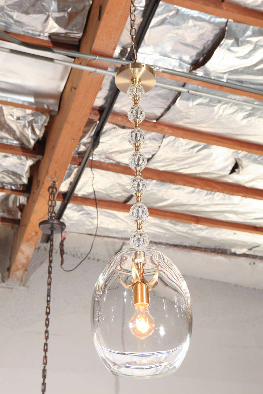 Modern unique pendant with vintage hand-cast glass, handblown glass and new brass finish and hardware. Measure: The height of 34