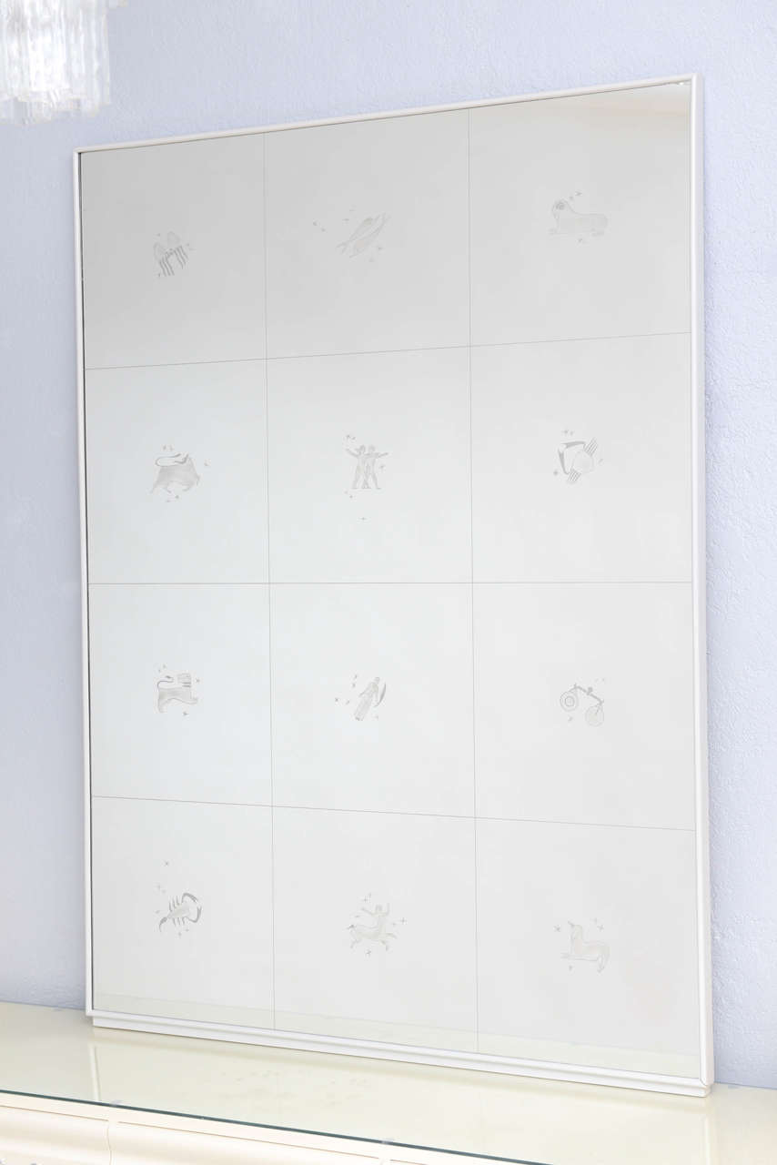 An impressive, large-scale 1950s Italian mirror attributed to Guglielmo Ulrich, which features each of the 12 astrological signs etched in glass. The original wall-mounted console that went with the piece is available on our 1st dibs storefront.
