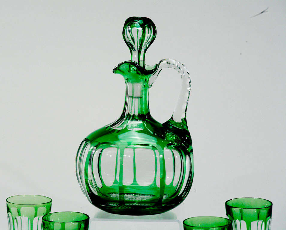 Baccarat 5 piece cordial set features a hand blown crystal decanter with handle,  overlaid in apple green and cut to clear in window-like panels. 4 small similarly decorated tumblers accompany this diminutive set. Also showing a rare Doulton Burslem