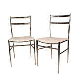 A PAIR OF GIO PONTI STYLE  CHROME AND LEATHER CHAIRS